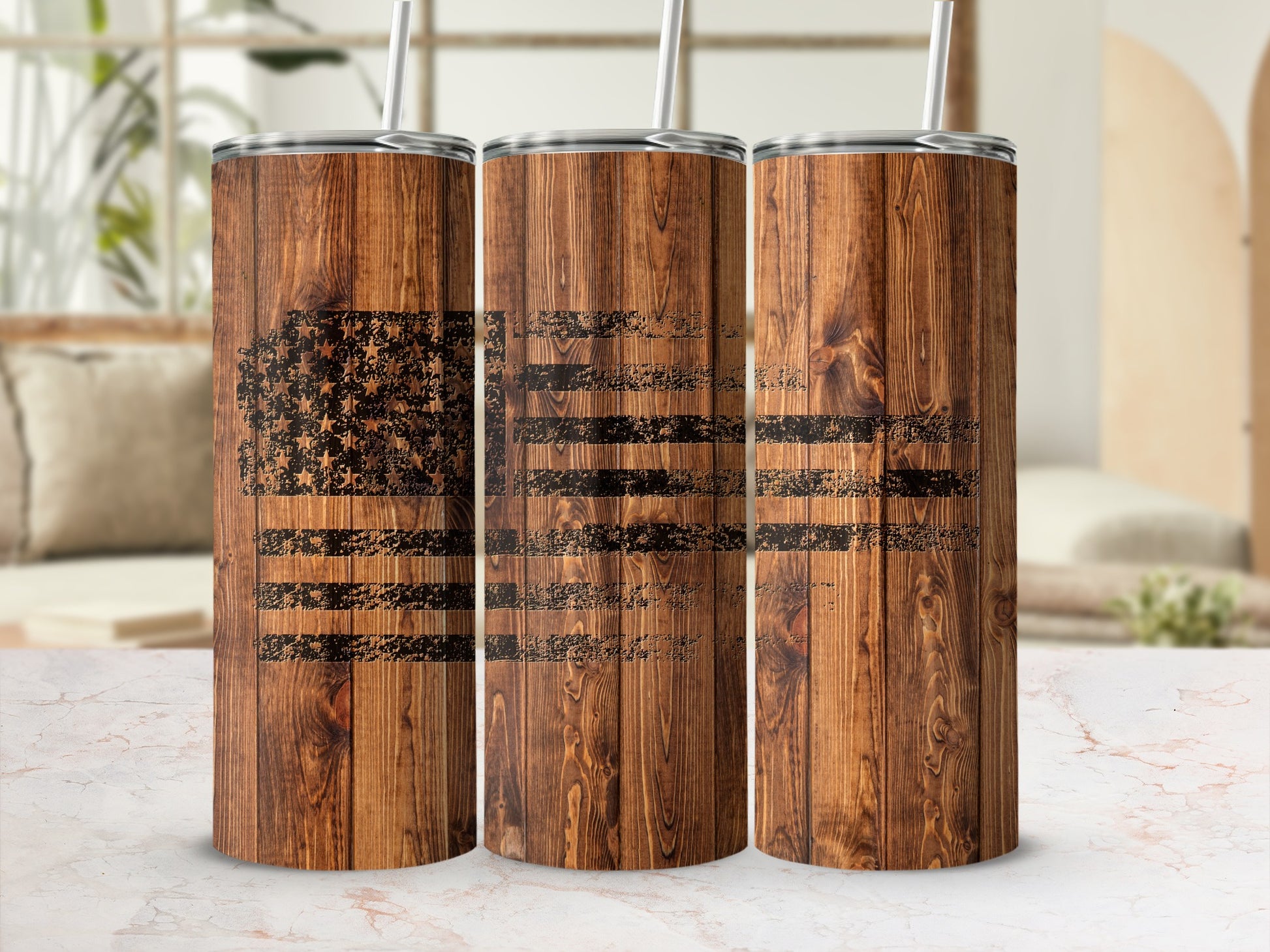 Three tumblers with distressed American flag design on wood grain background.