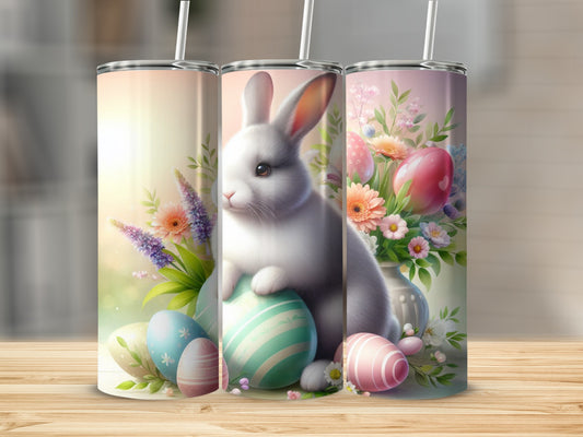 Easter bunny with decorated eggs and flowers in a vase.