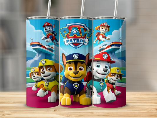 Paw Patrol characters Chase, Marshall, and Ryder on a blue and pink tumbler.