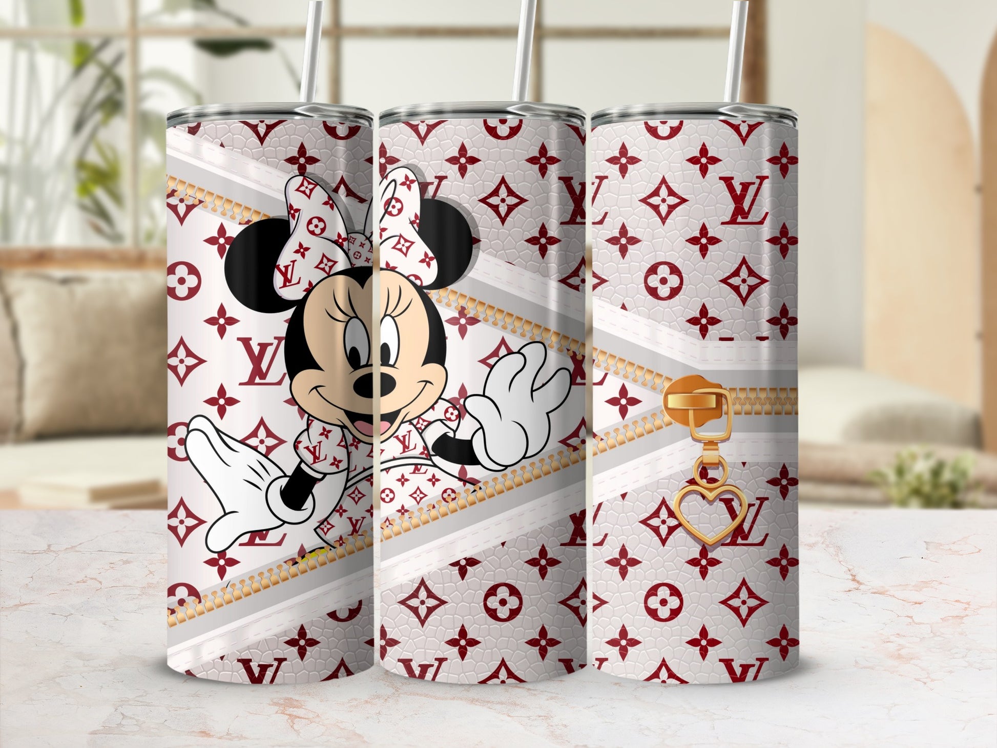 Minnie Mouse on a white tumbler with red monogram and gold zipper detail.