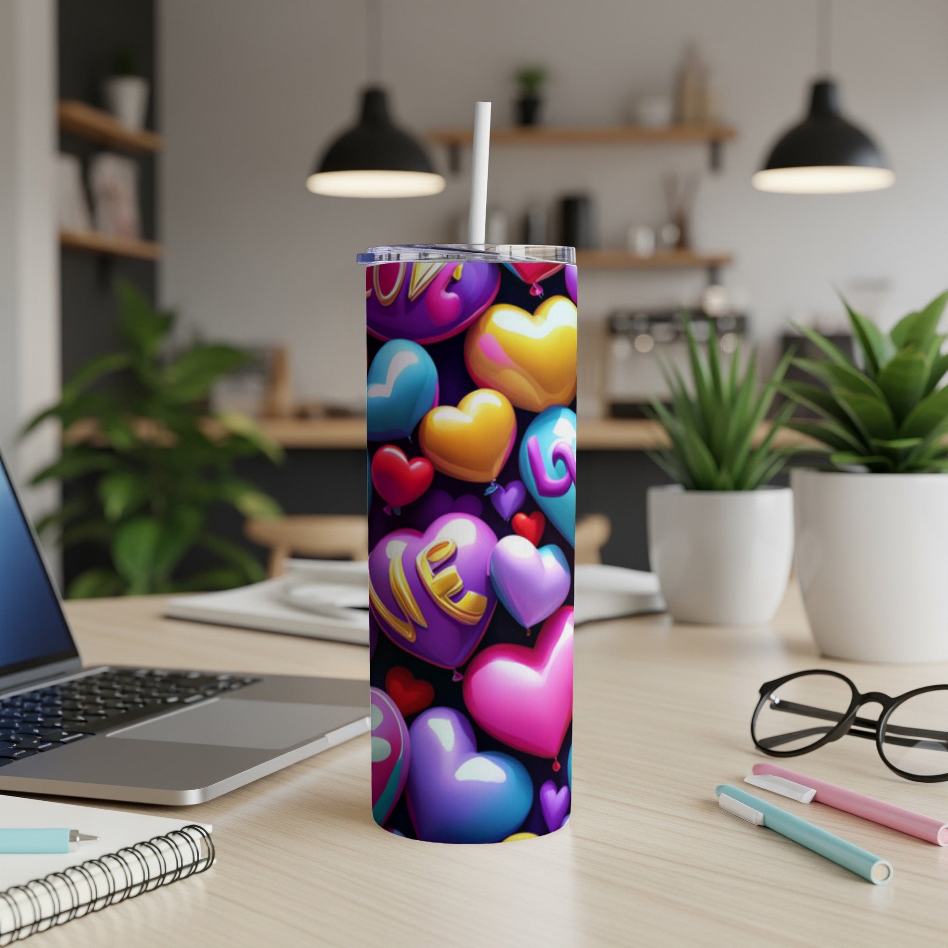 Tumbler with colorful heart-shaped balloons and "love" text.