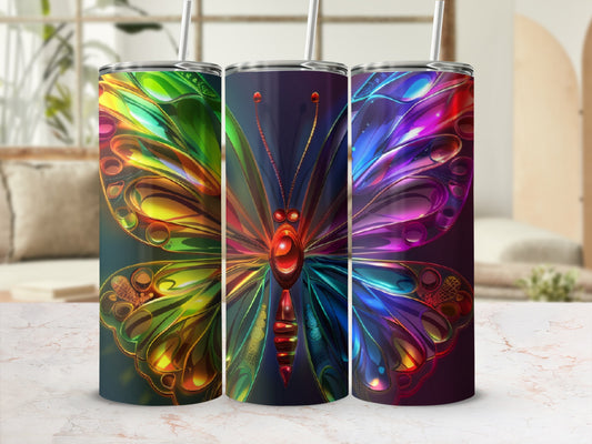 Colorful abstract butterfly design on three tumblers with straws.