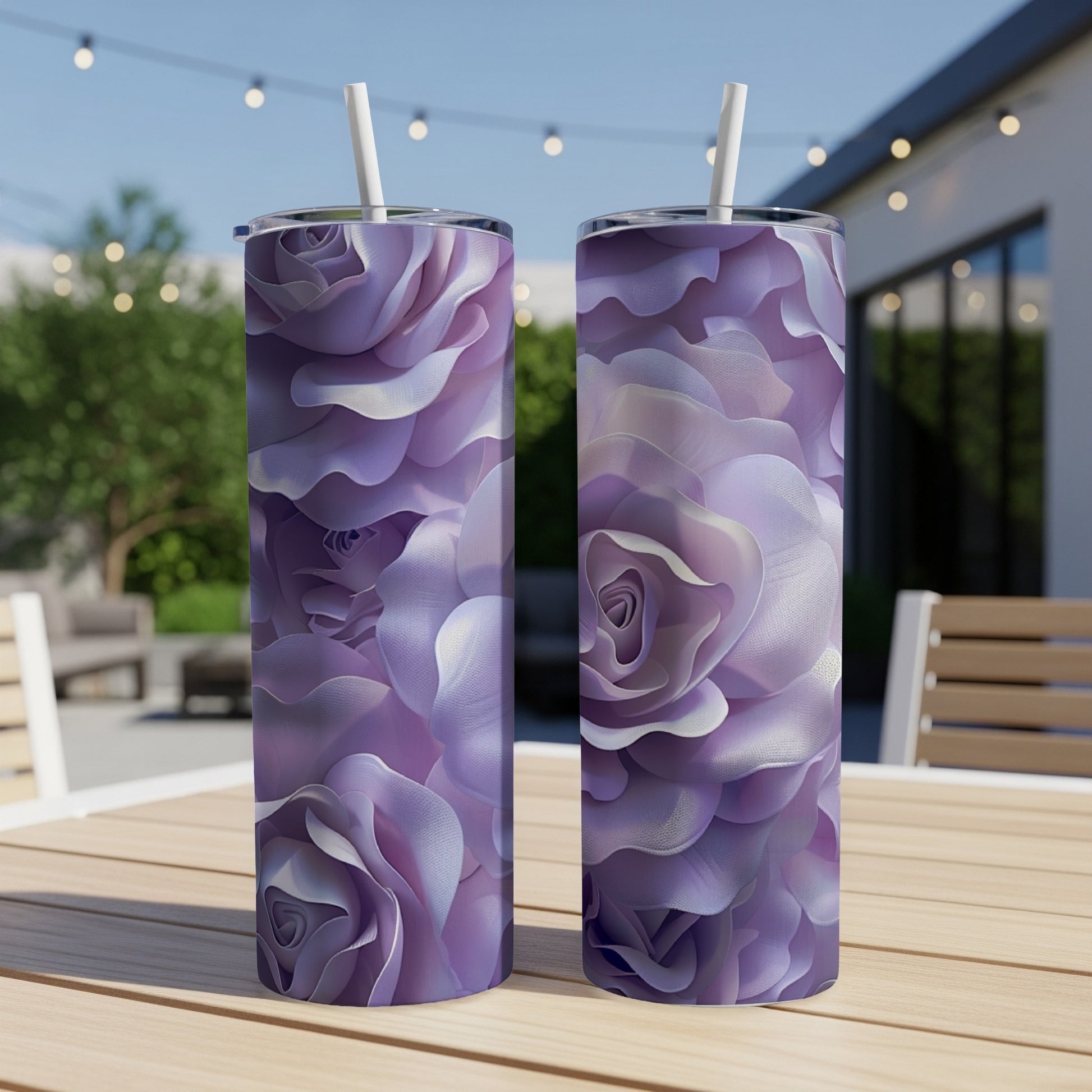 Two tall tumblers with purple rose floral pattern on a wooden table.