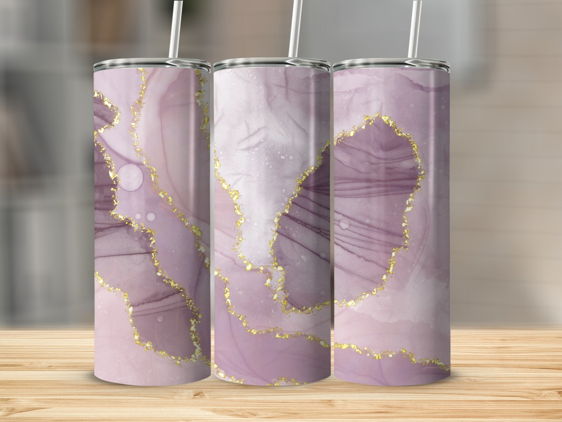 Three tumblers with marbled purple and gold abstract design.