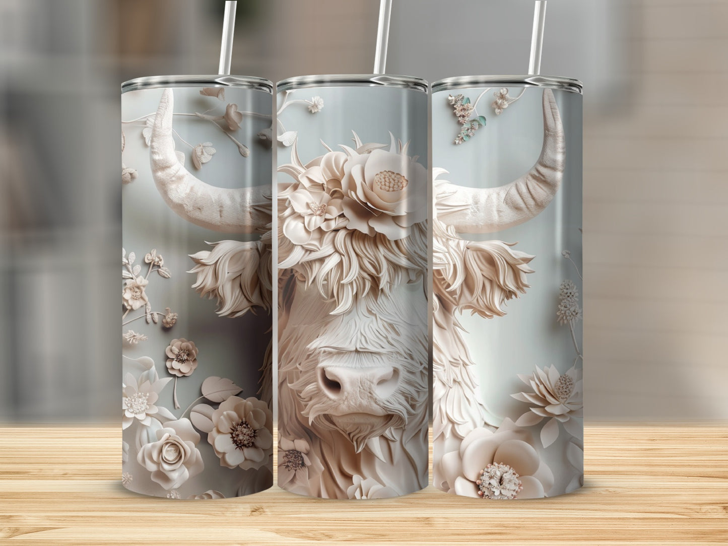 Highland cow tumbler with floral embellishments and straws.