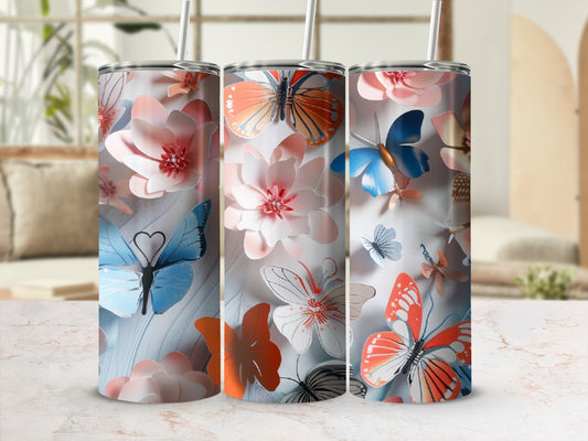 Tumbler with a watercolor butterfly and floral pattern.