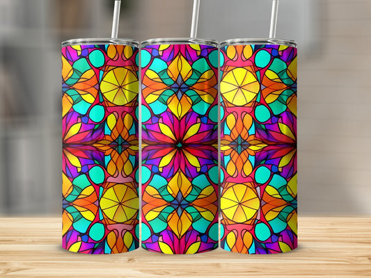 Three stained-glass pattern tumblers on a wooden surface.