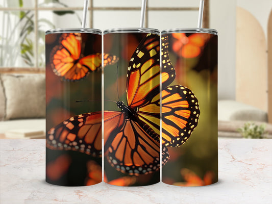 Monarch butterfly on a tumbler with a bokeh background.