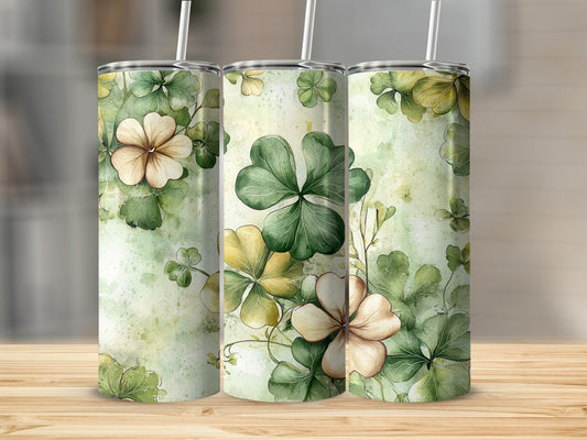 Three tumblers with a watercolor floral and clover pattern.