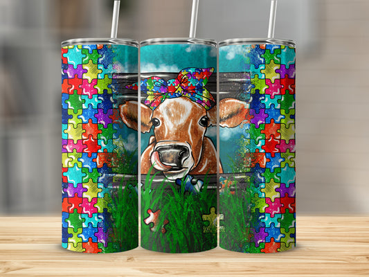 Cow with puzzle pattern headband behind grassy fence, colorful puzzle border.