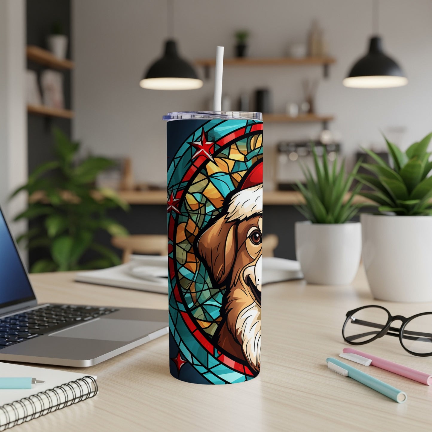 Dog wearing Santa hat on stained glass pattern tumbler.