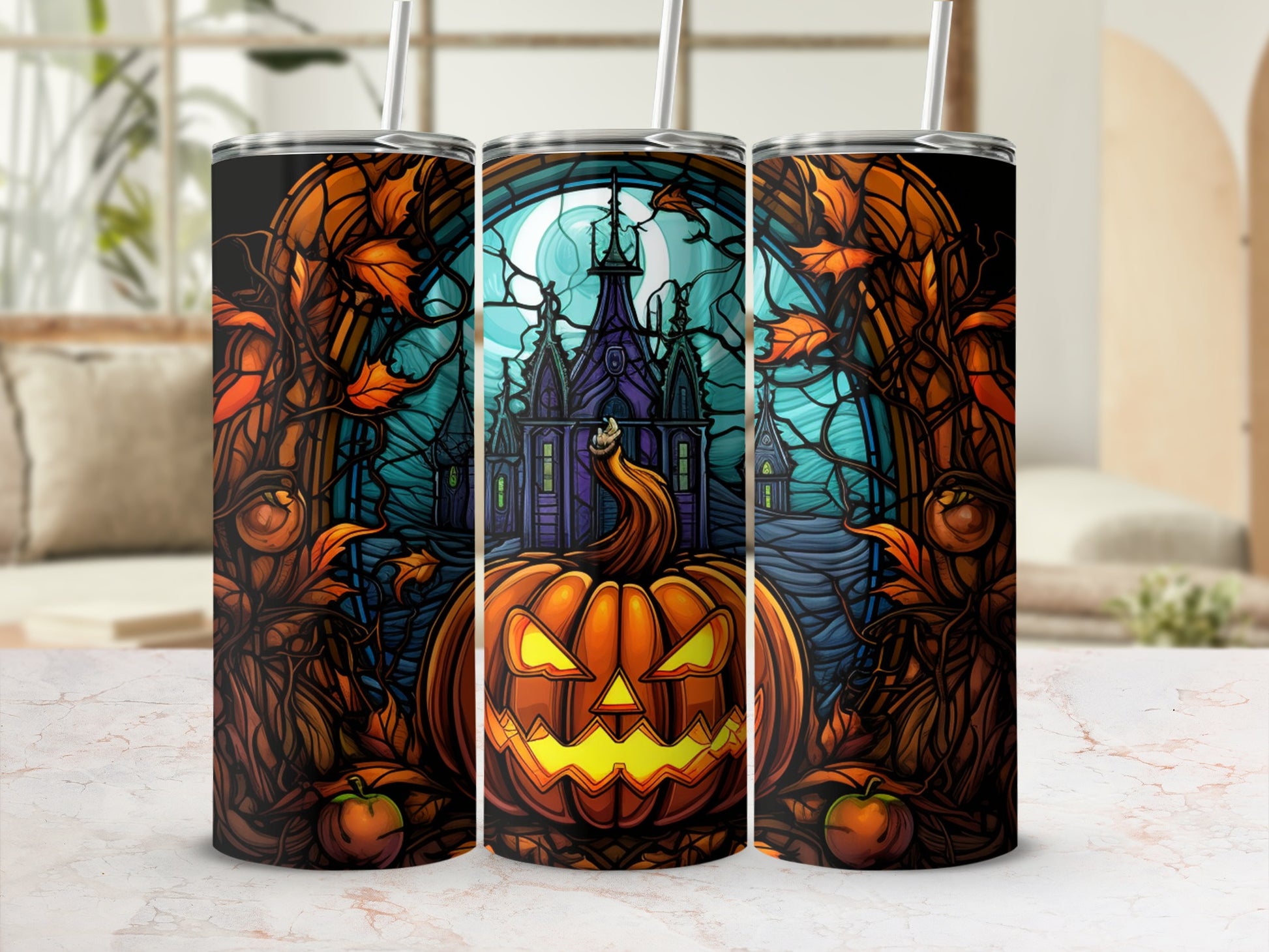 Halloween tumbler with jack-o'-lantern, haunted house, and autumn leaves.