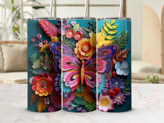 Teal tumbler with colorful butterfly and floral pattern.