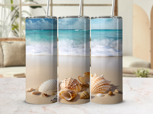 Three tumblers with a beach scene and seashells.