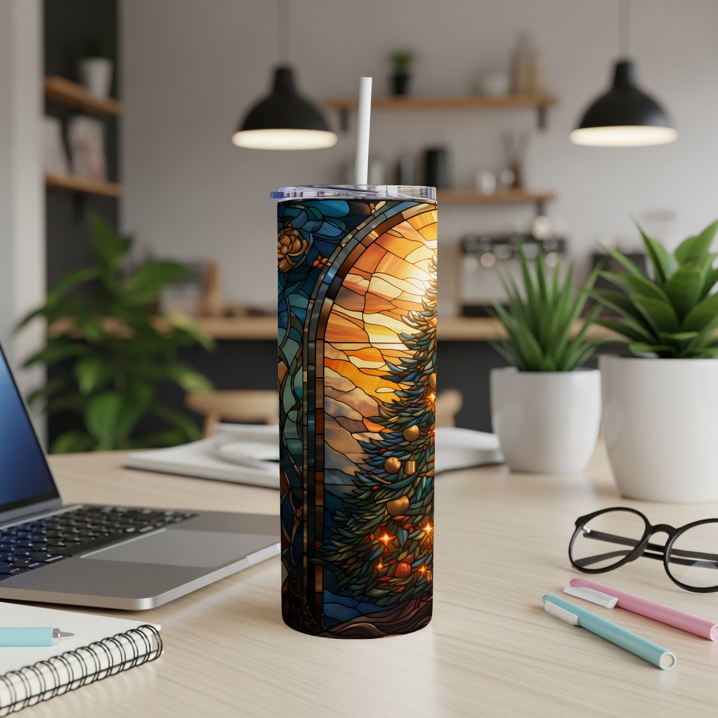 Stained glass tumbler with a Christmas tree and sun design.