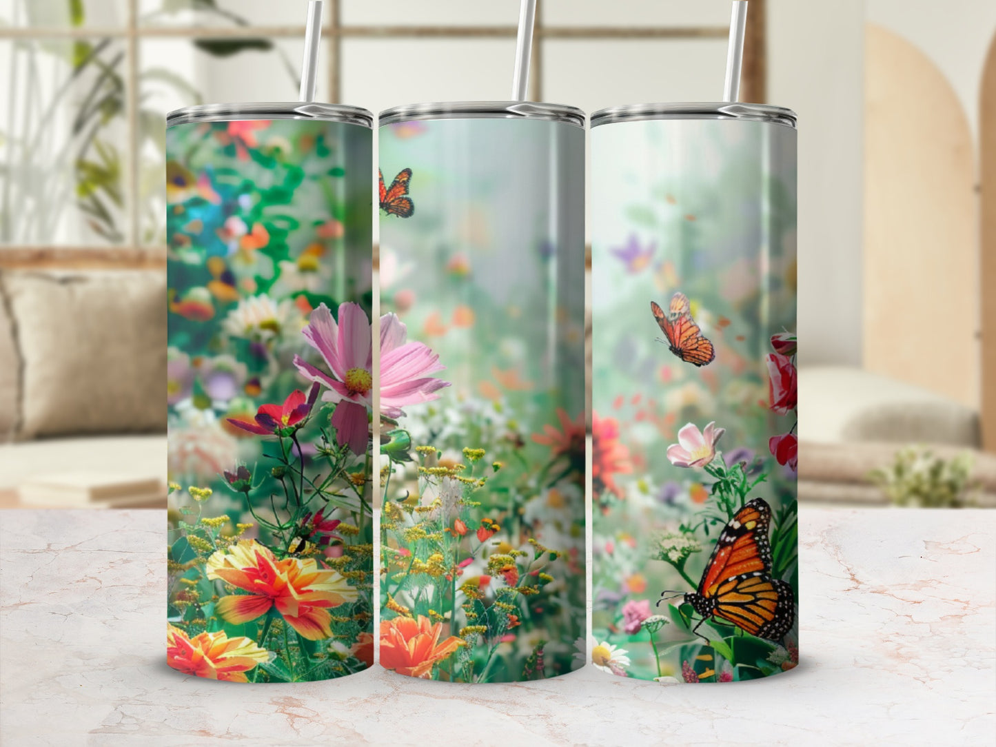 Three tumblers with a floral and butterfly design.