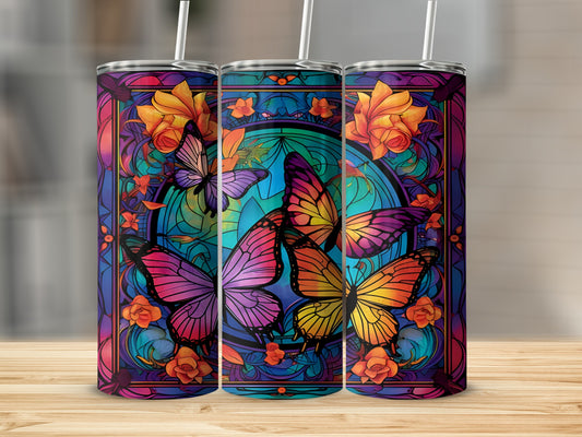 Three tumblers with vibrant stained-glass butterfly and floral designs.