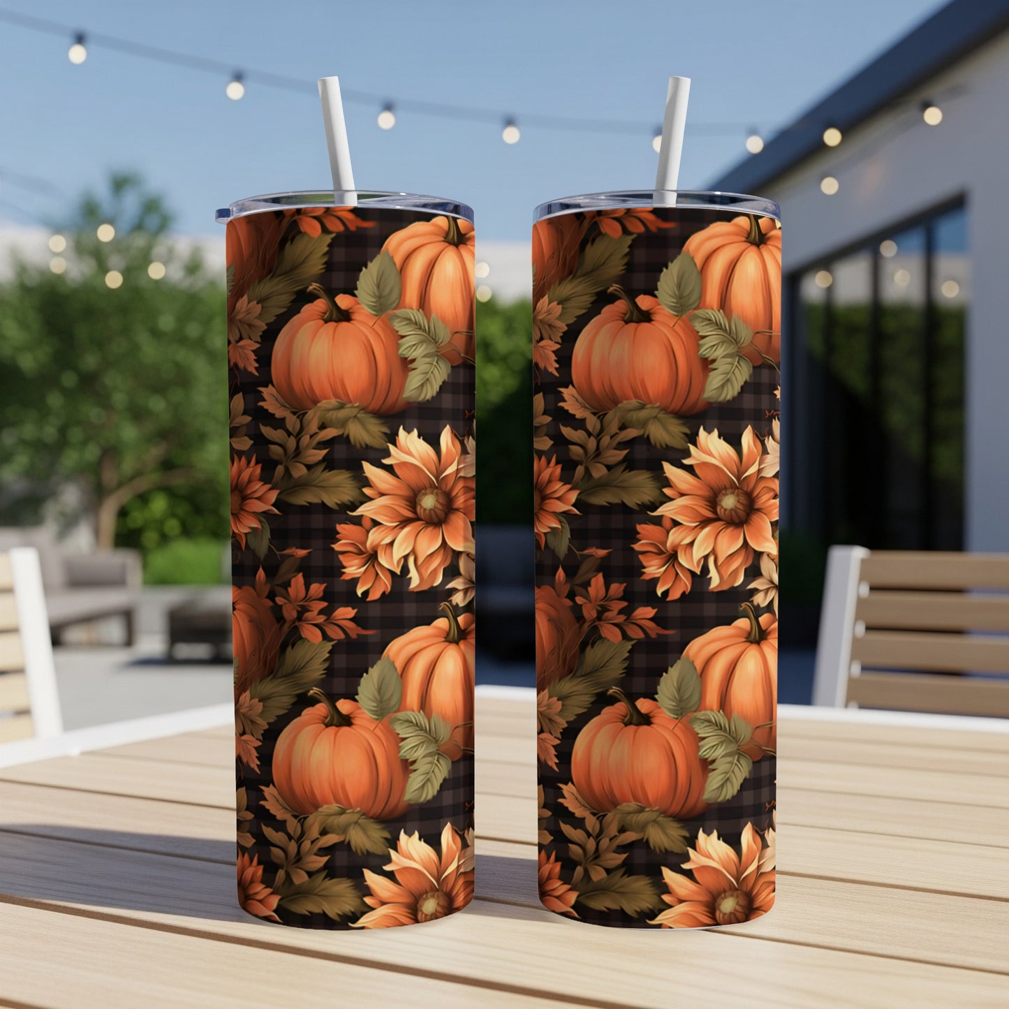 Two tumblers with a fall pumpkin and sunflower plaid pattern.