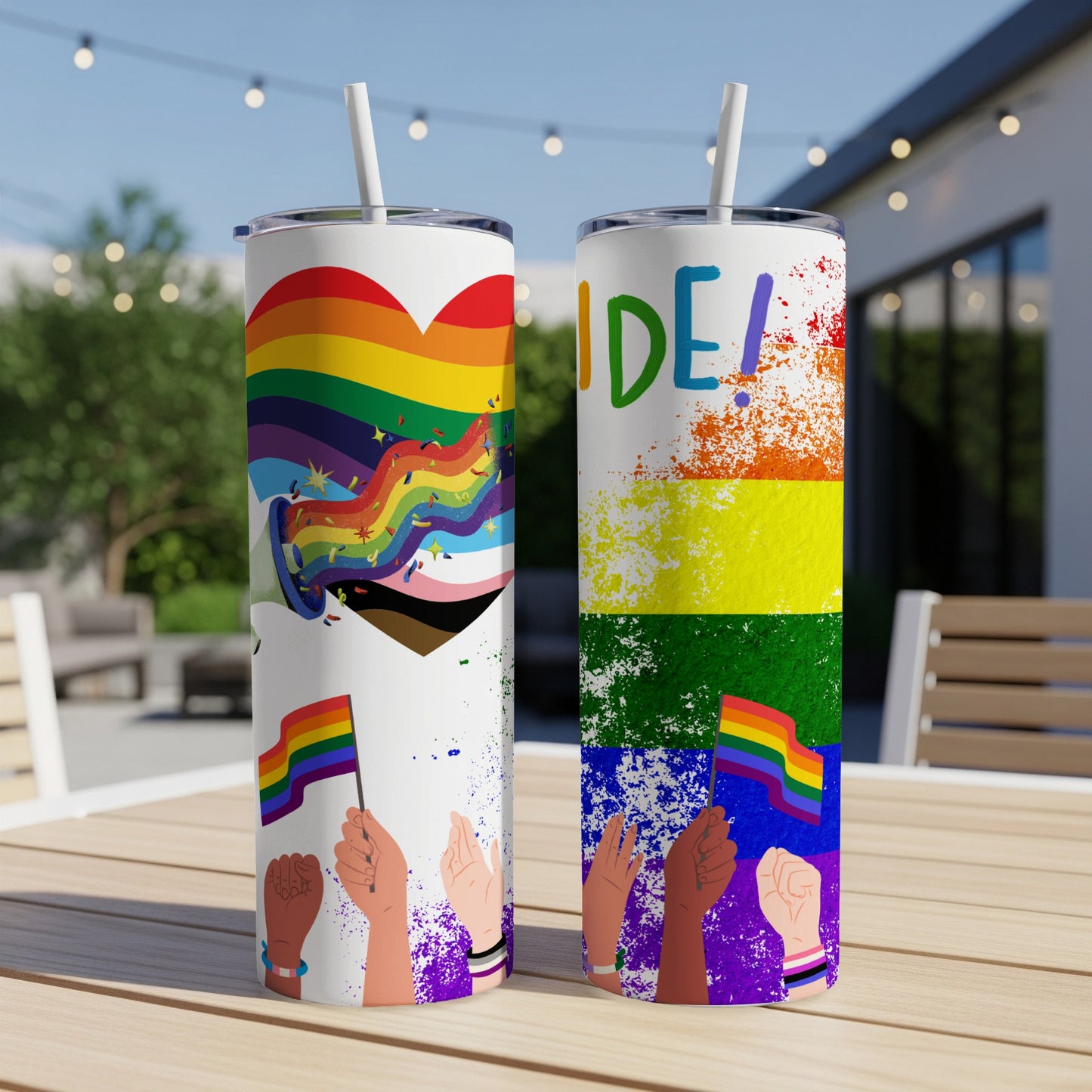 Two Pride-themed tumblers with rainbow designs and colorful confetti.