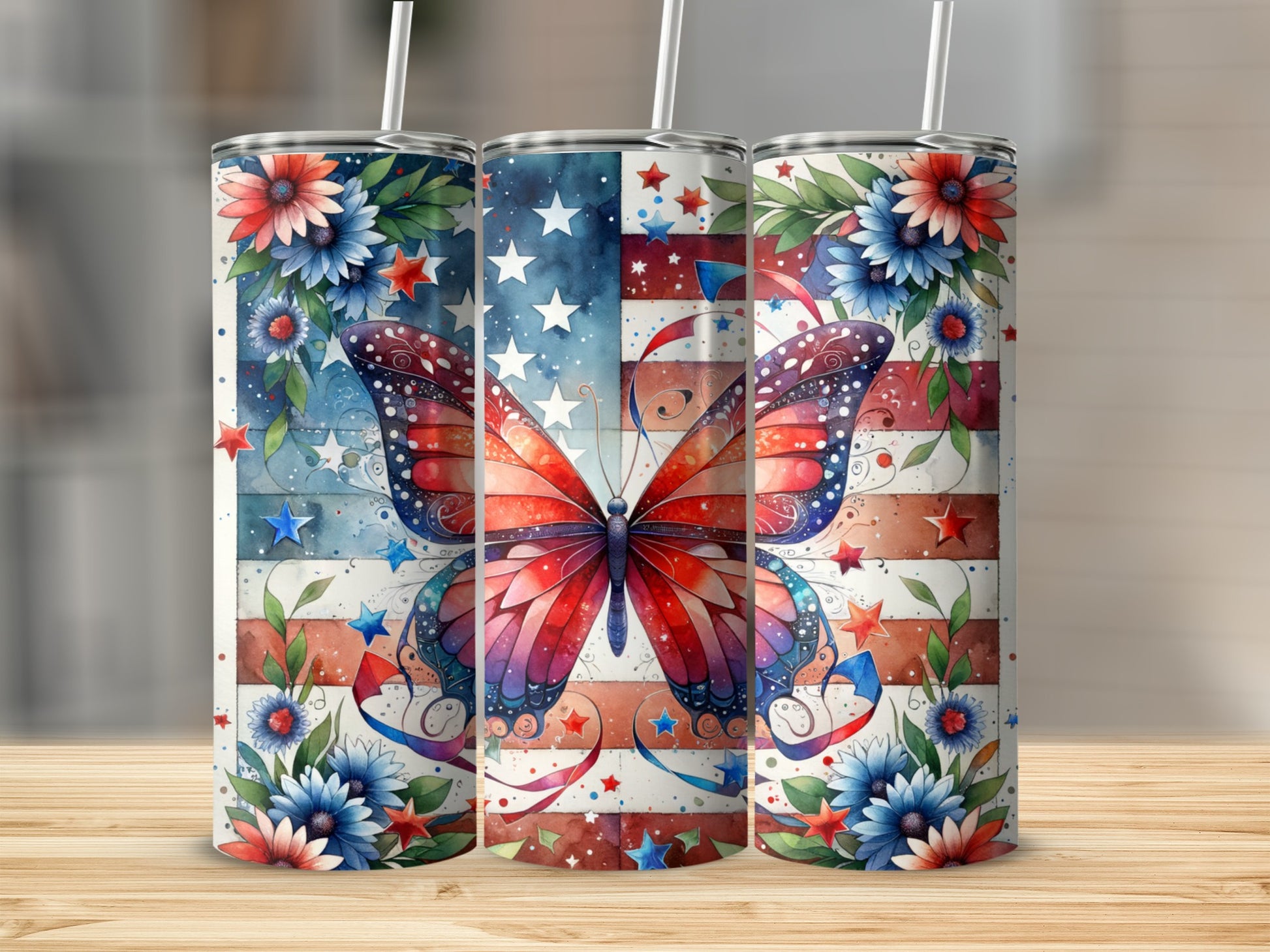 Three patriotic tumblers with butterfly and floral designs.
