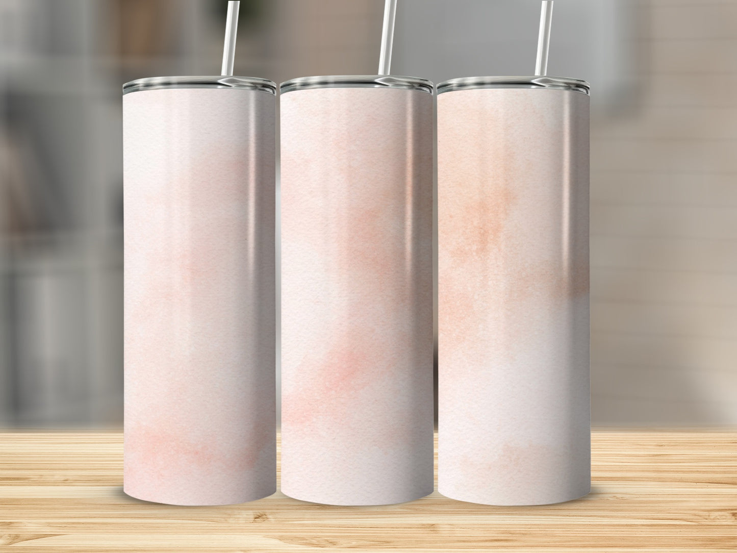 Three blank skinny tumblers with a light pink watercolor design.