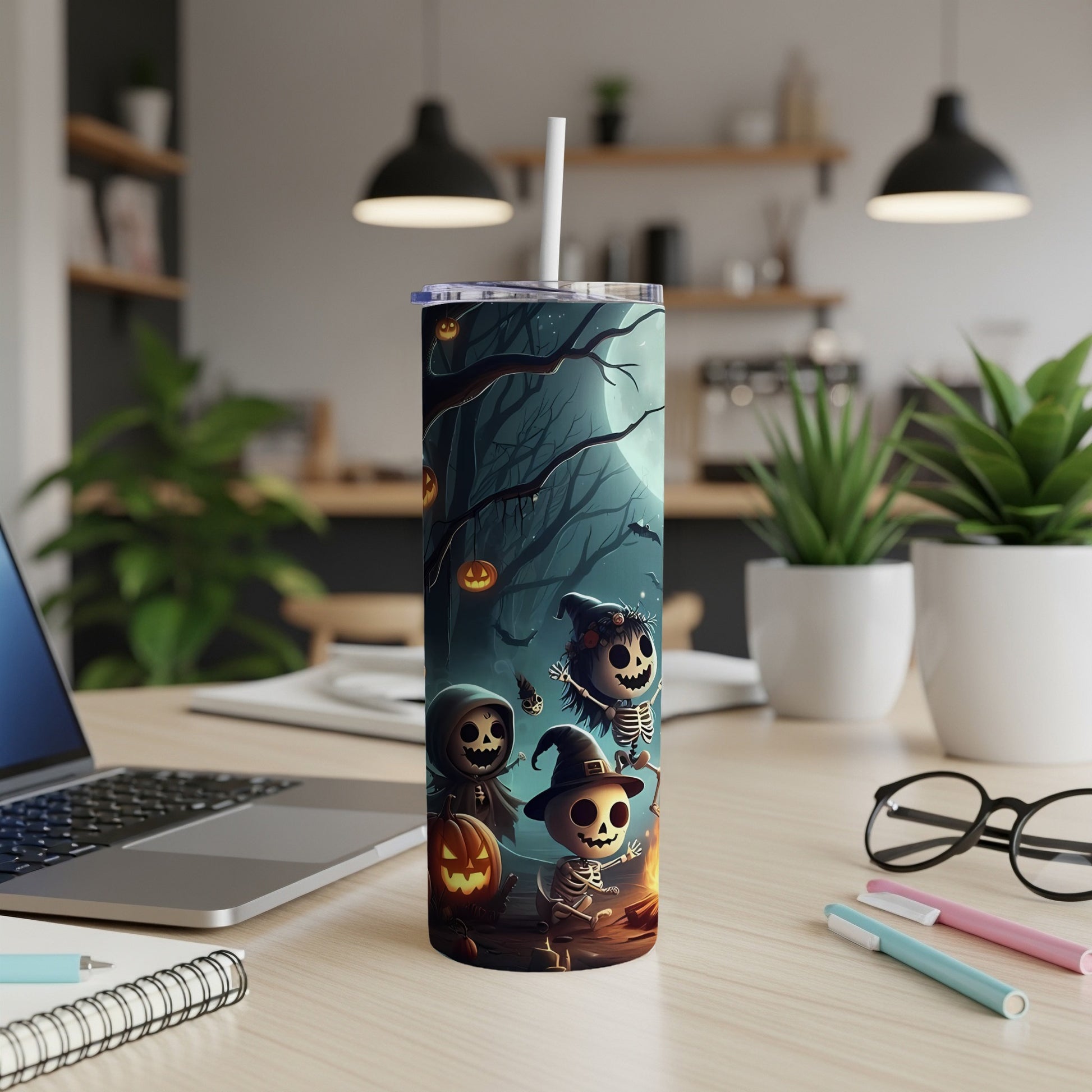 Tumbler with spooky Halloween cartoon characters around a campfire under a full moon.