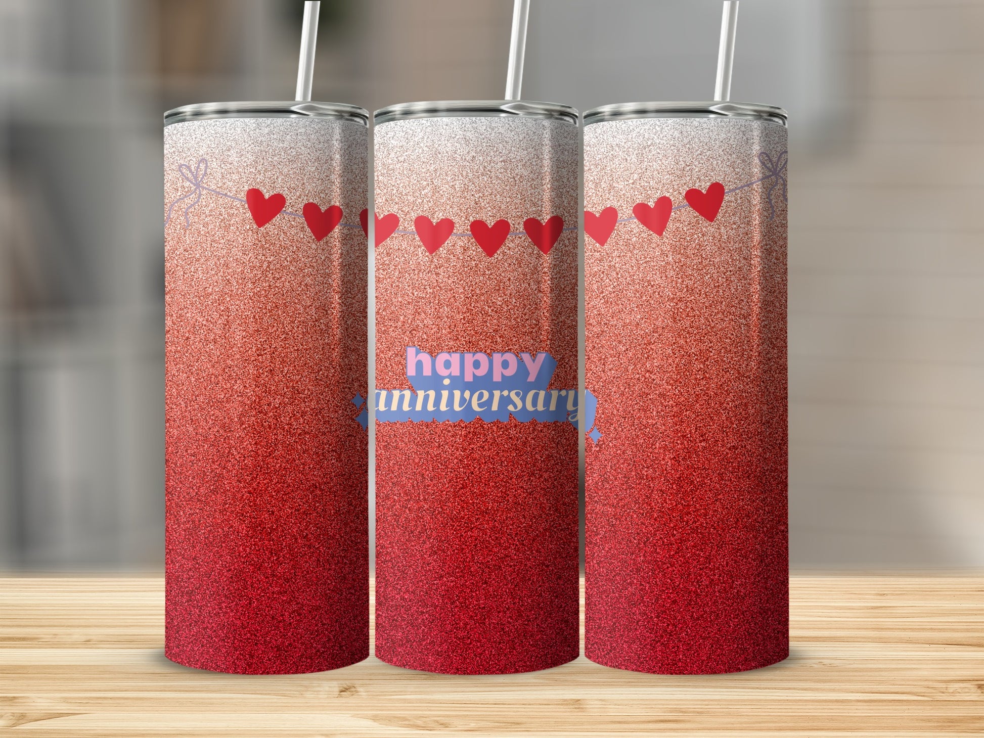 Three tumblers with red glitter and "happy anniversary" text.