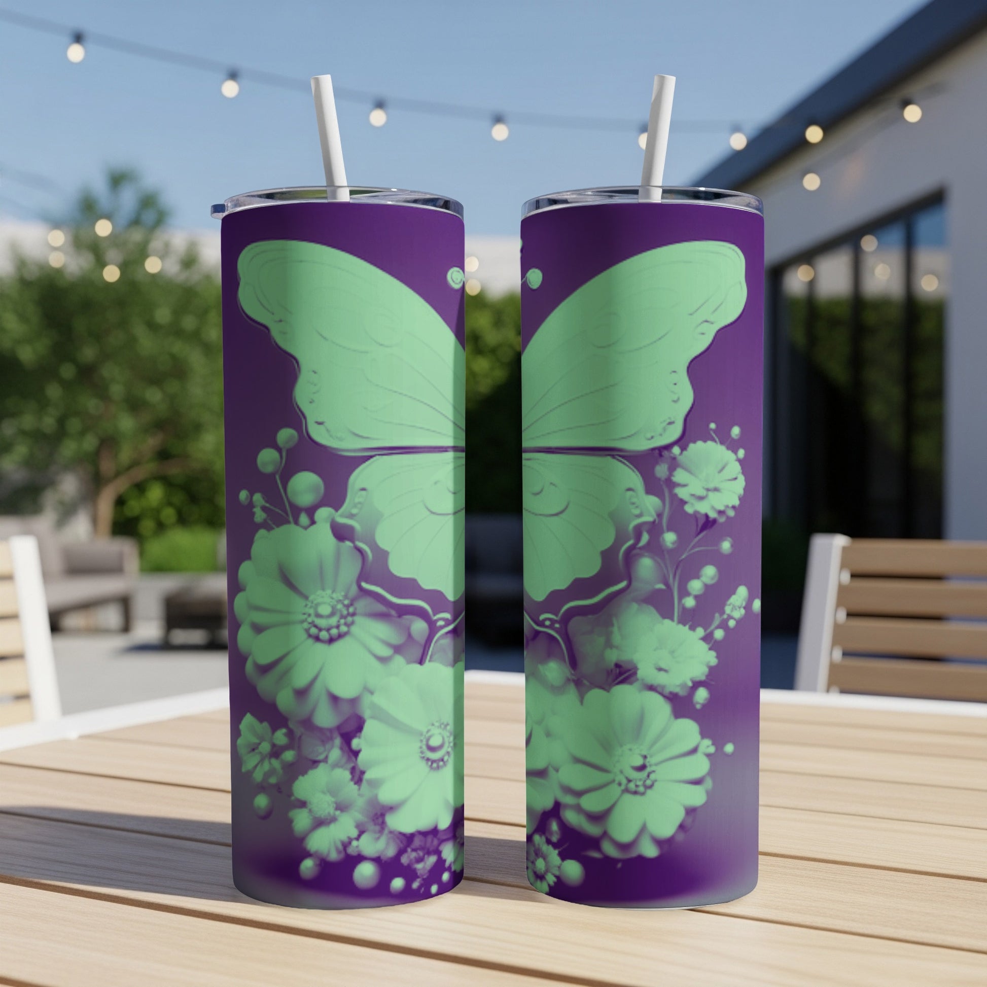 Two purple tumblers with mint green butterfly and floral design.