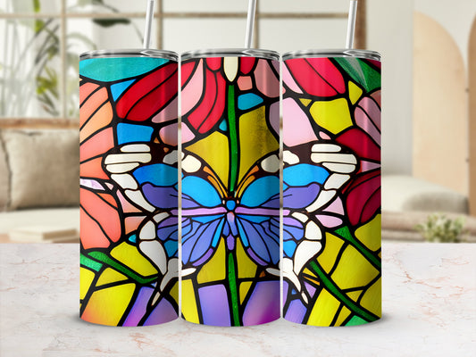 Three colorful stained-glass butterfly tumblers with straws.