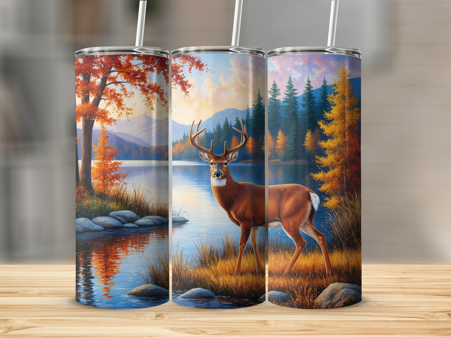 Deer by lake with autumn trees and mountains, on a tumbler.