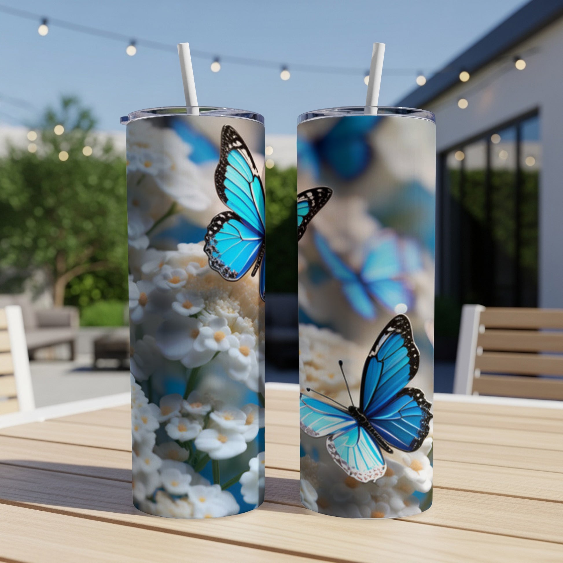 Two tumblers featuring blue butterflies and white flowers.