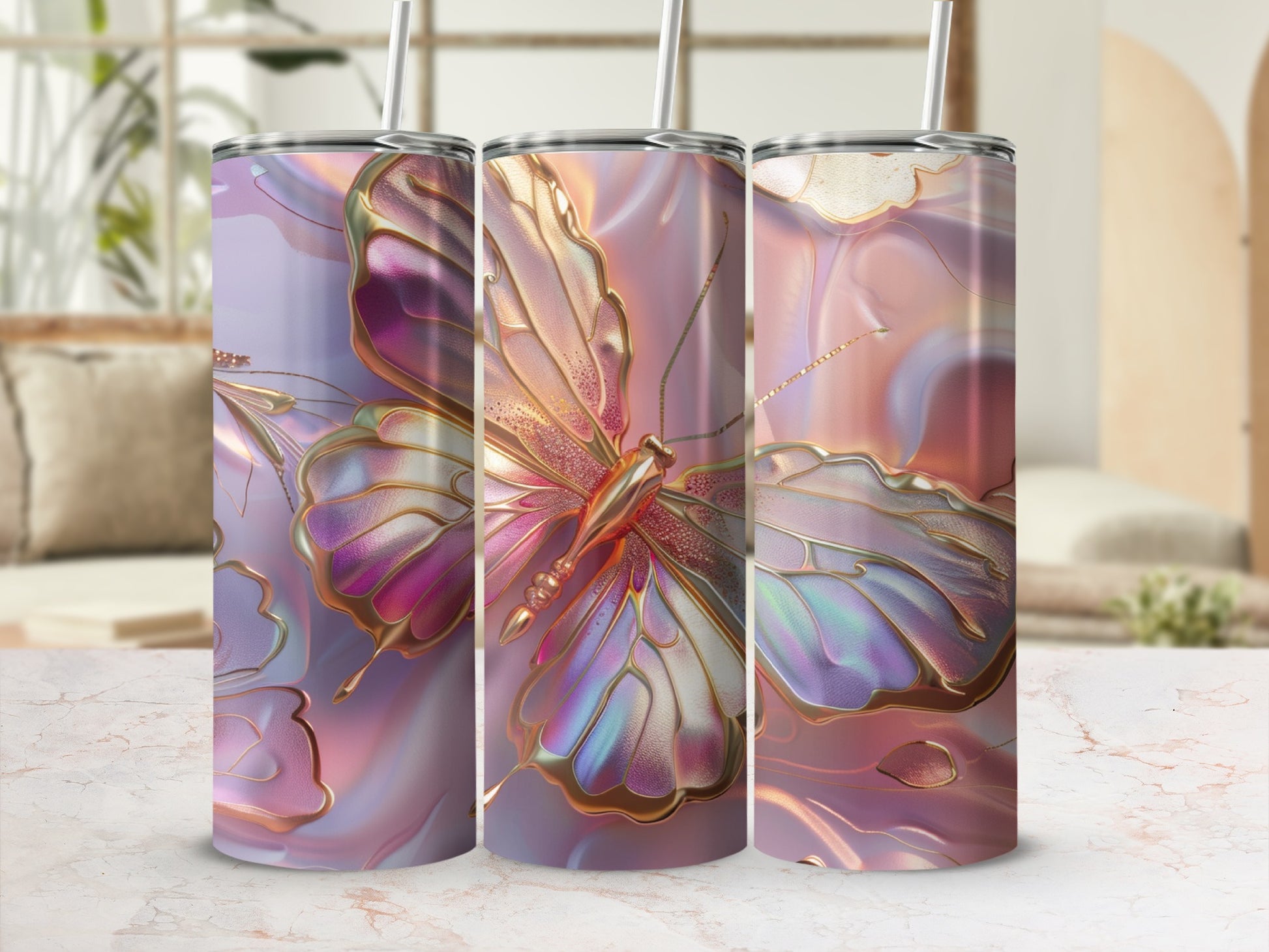 Three iridescent tumblers with butterfly and gold swirl patterns.