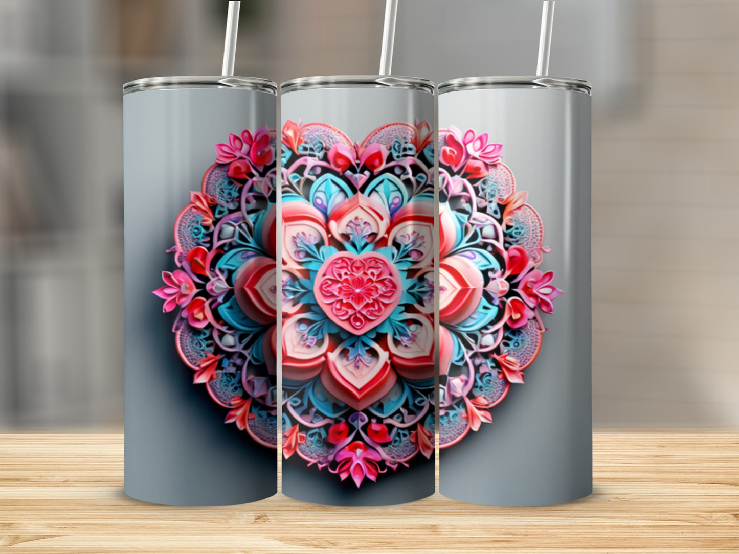 Three tumblers with vibrant pink and blue floral mandala designs.
