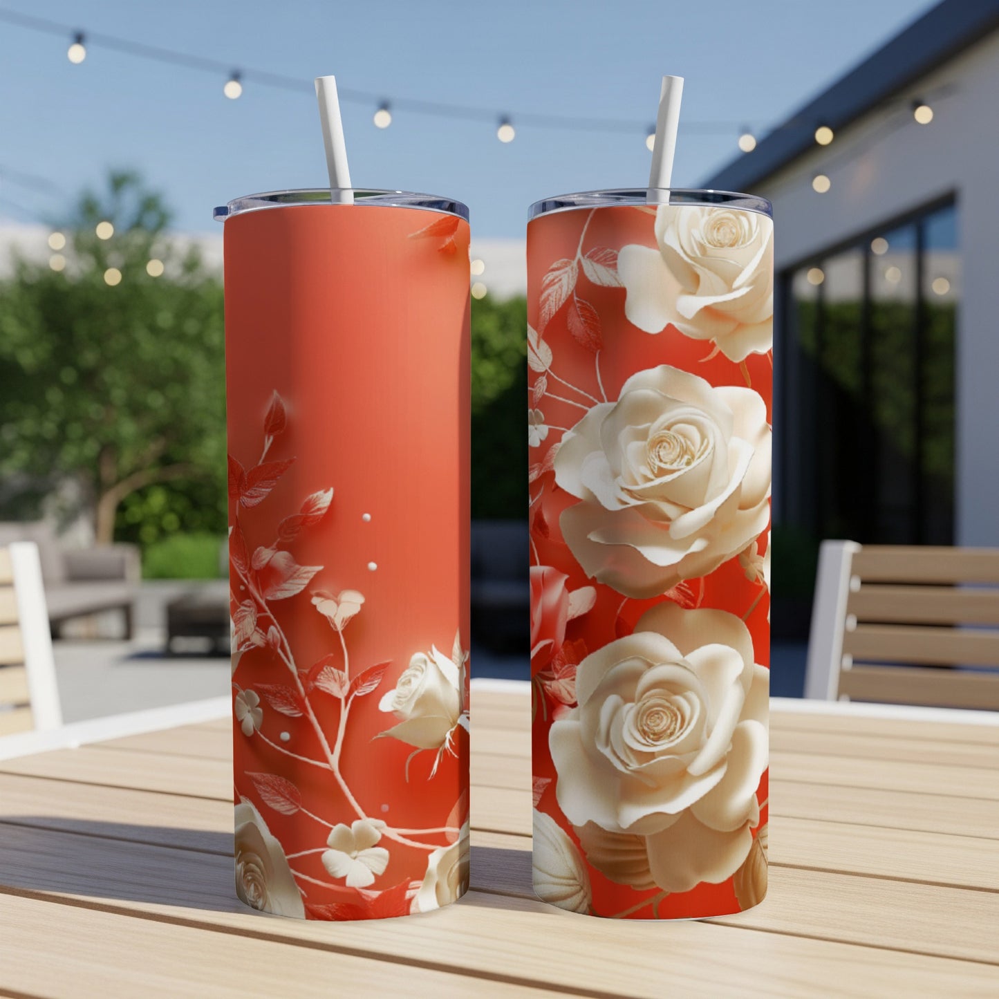 Two coral tumblers with cream roses and leaves design.