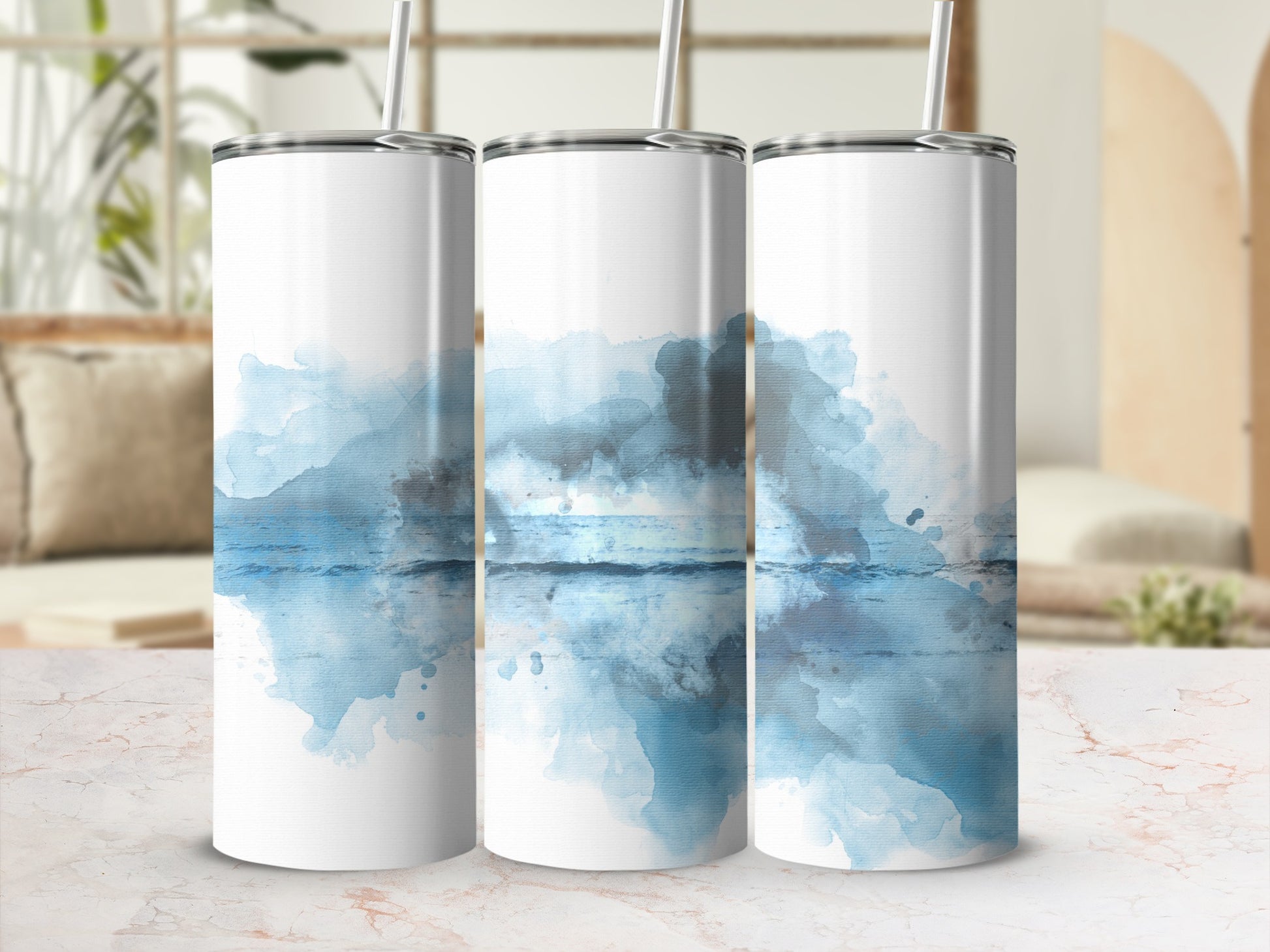 Three tumblers with a watercolor ocean sunset design.