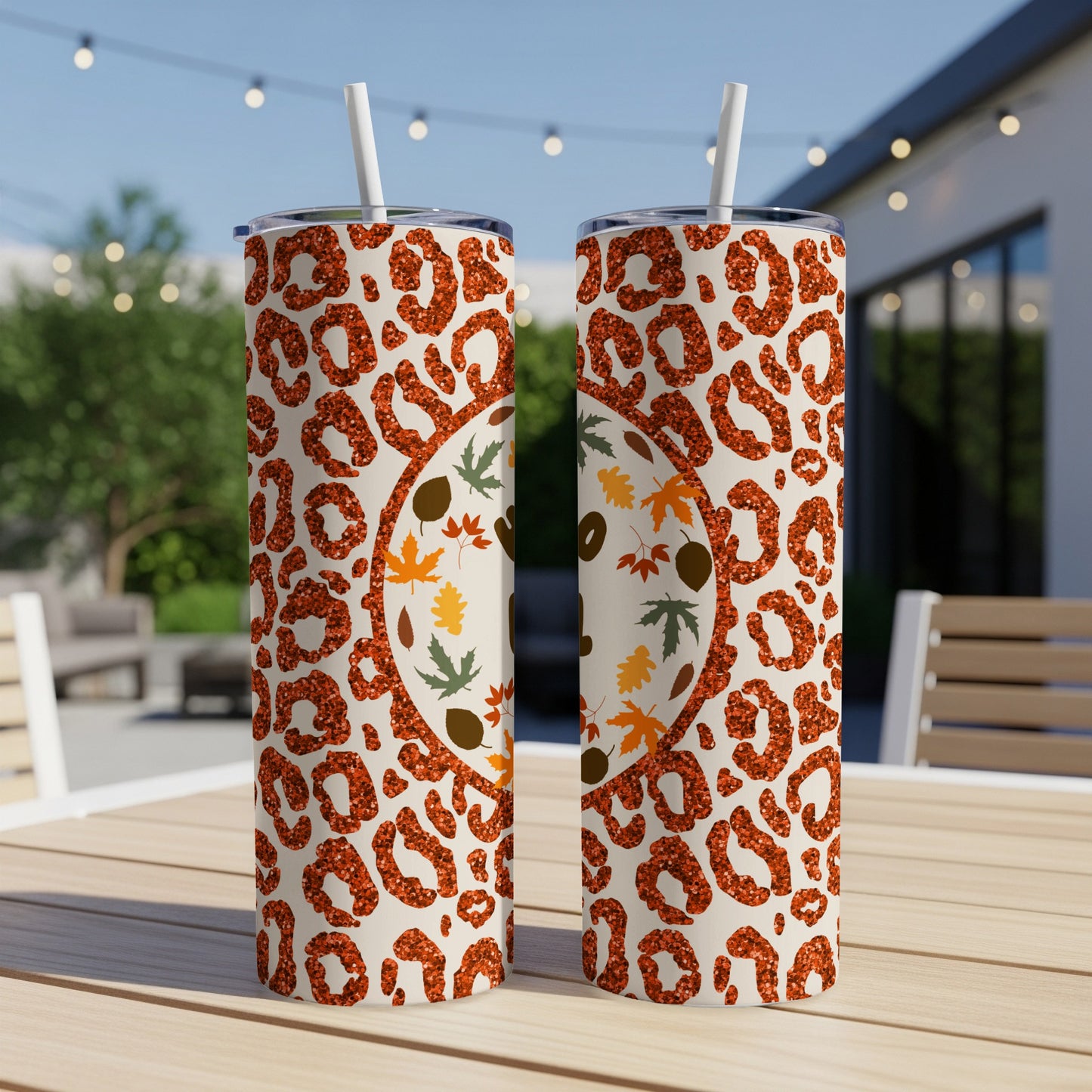 Two tumblers with leopard print and glitter design, featuring fall leaves.