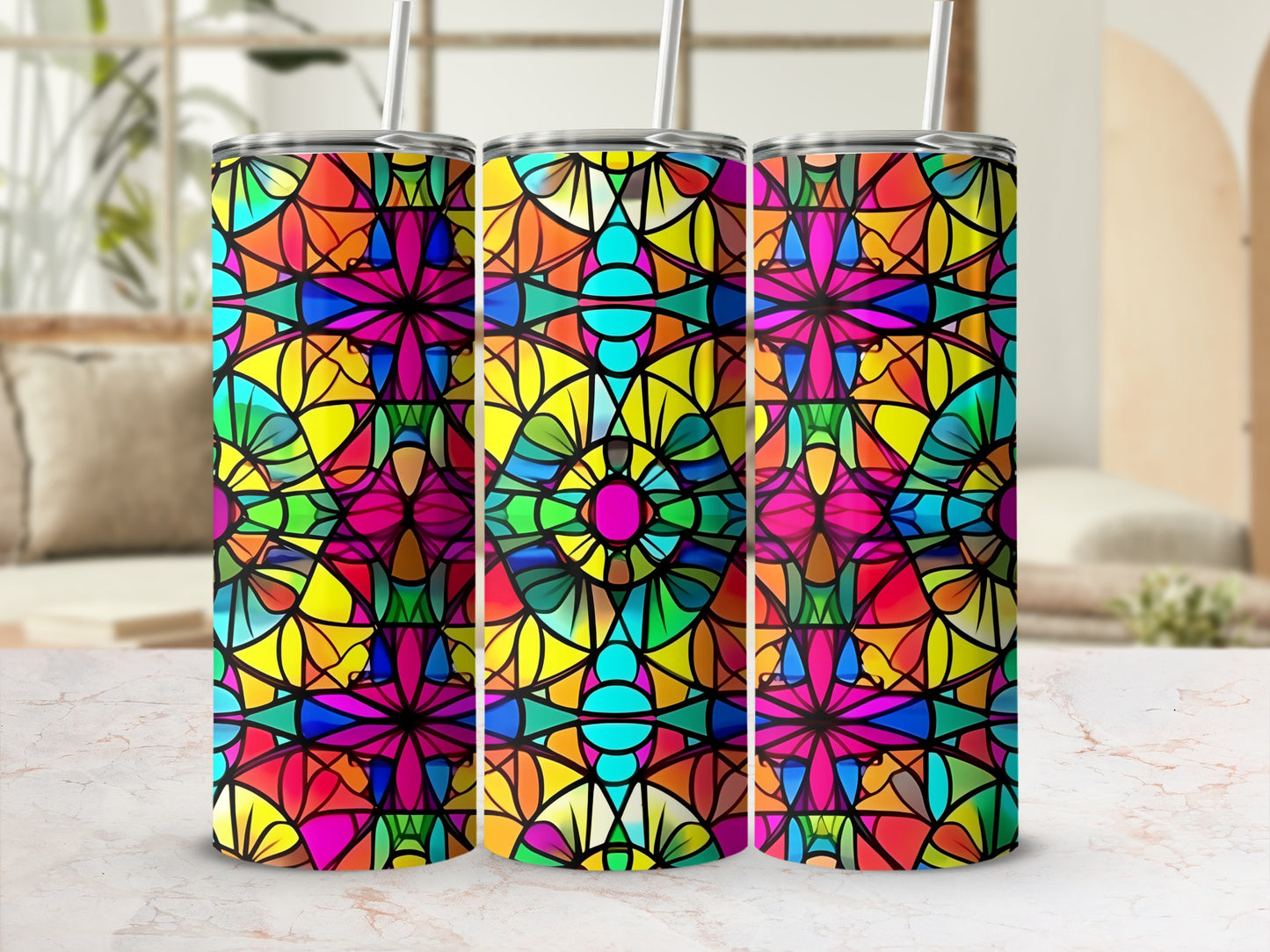 Three colorful stained-glass tumblers with geometric patterns.