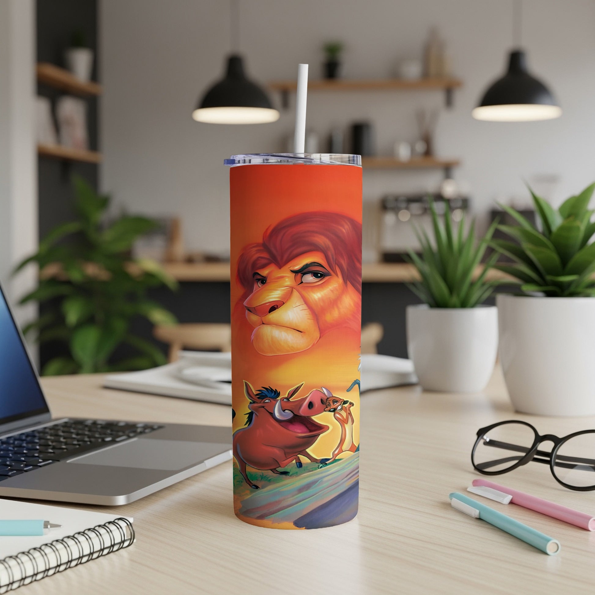 The Lion King characters Simba, Timon, and Pumbaa on an orange tumbler.