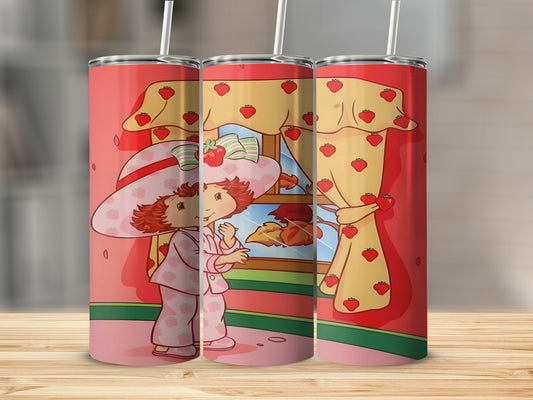 Strawberry Shortcake in pajamas and hat by a window.
