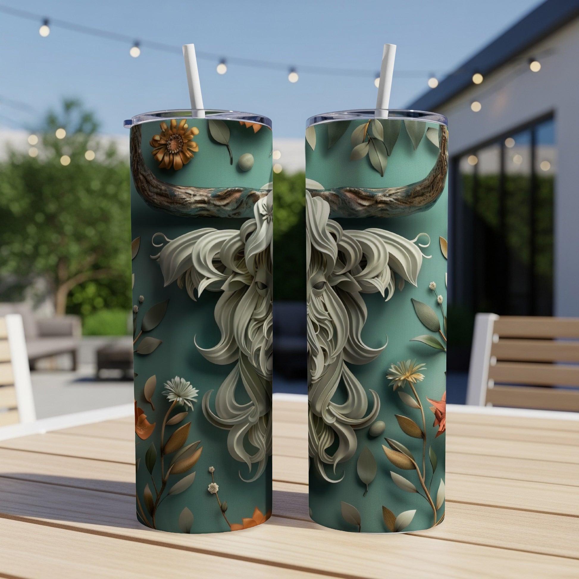 Two teal tumblers with ornate white and brown floral designs.