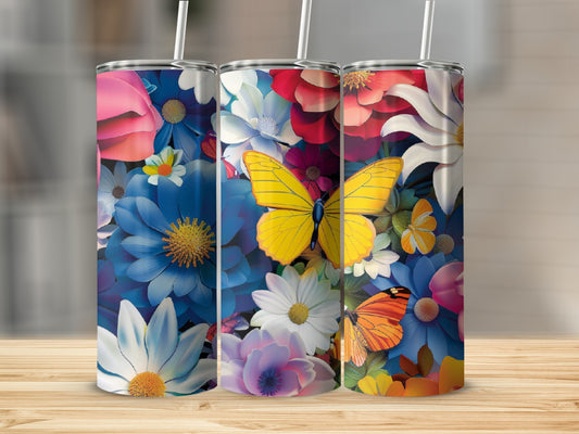 Three tumblers with floral and butterfly designs on a wooden surface.