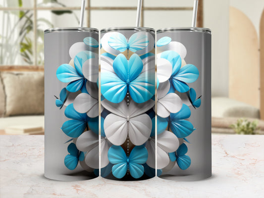 Three tall tumblers with a white and blue floral butterfly design.