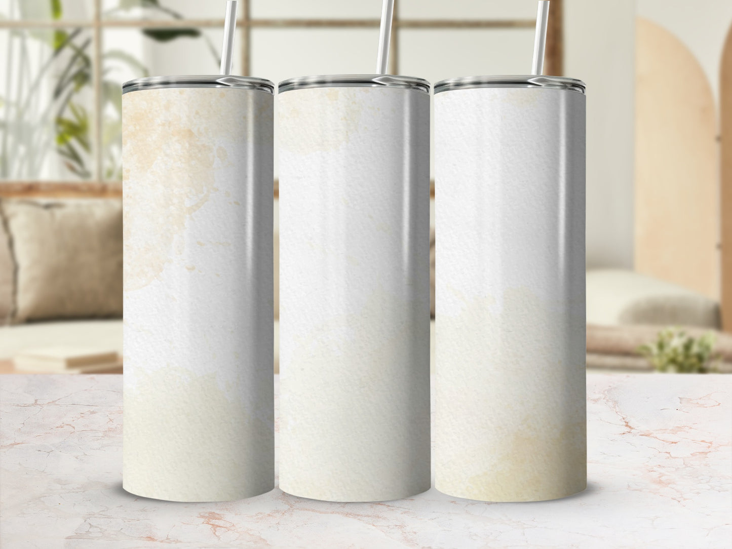 Three white tumblers with subtle watercolor-like stains and straws.