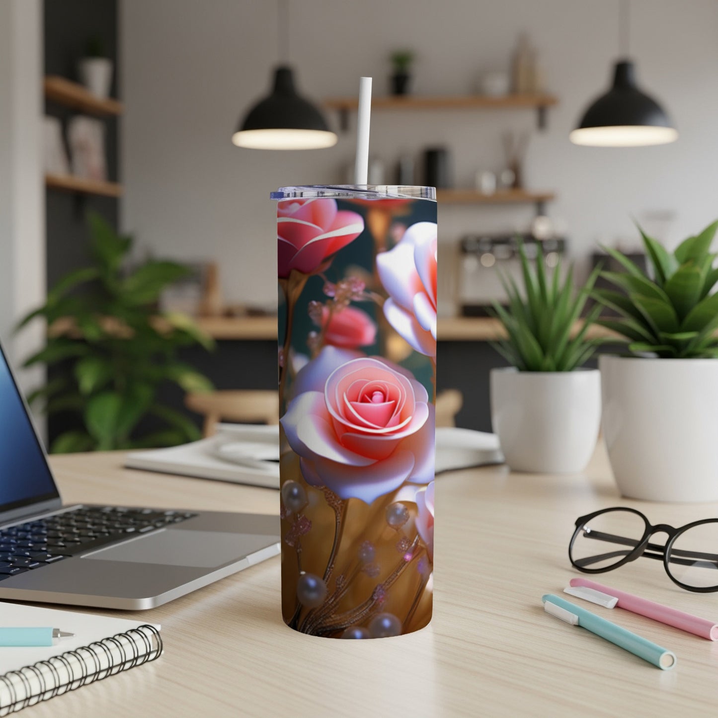 Pink and white roses adorn a tall, insulated tumbler with a straw.