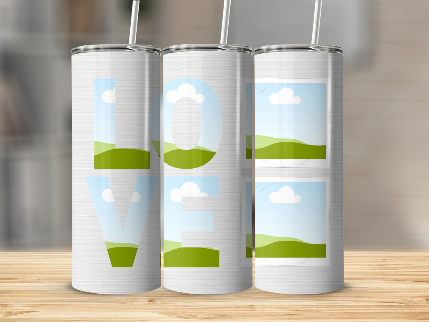 Three tumblers with the word "LOVE" designed with landscape images.