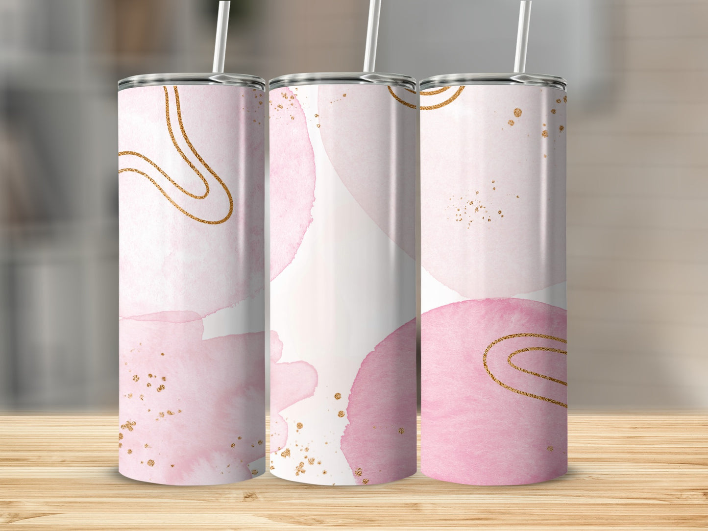 Three skinny tumblers with pink watercolor brushstrokes and gold accents.