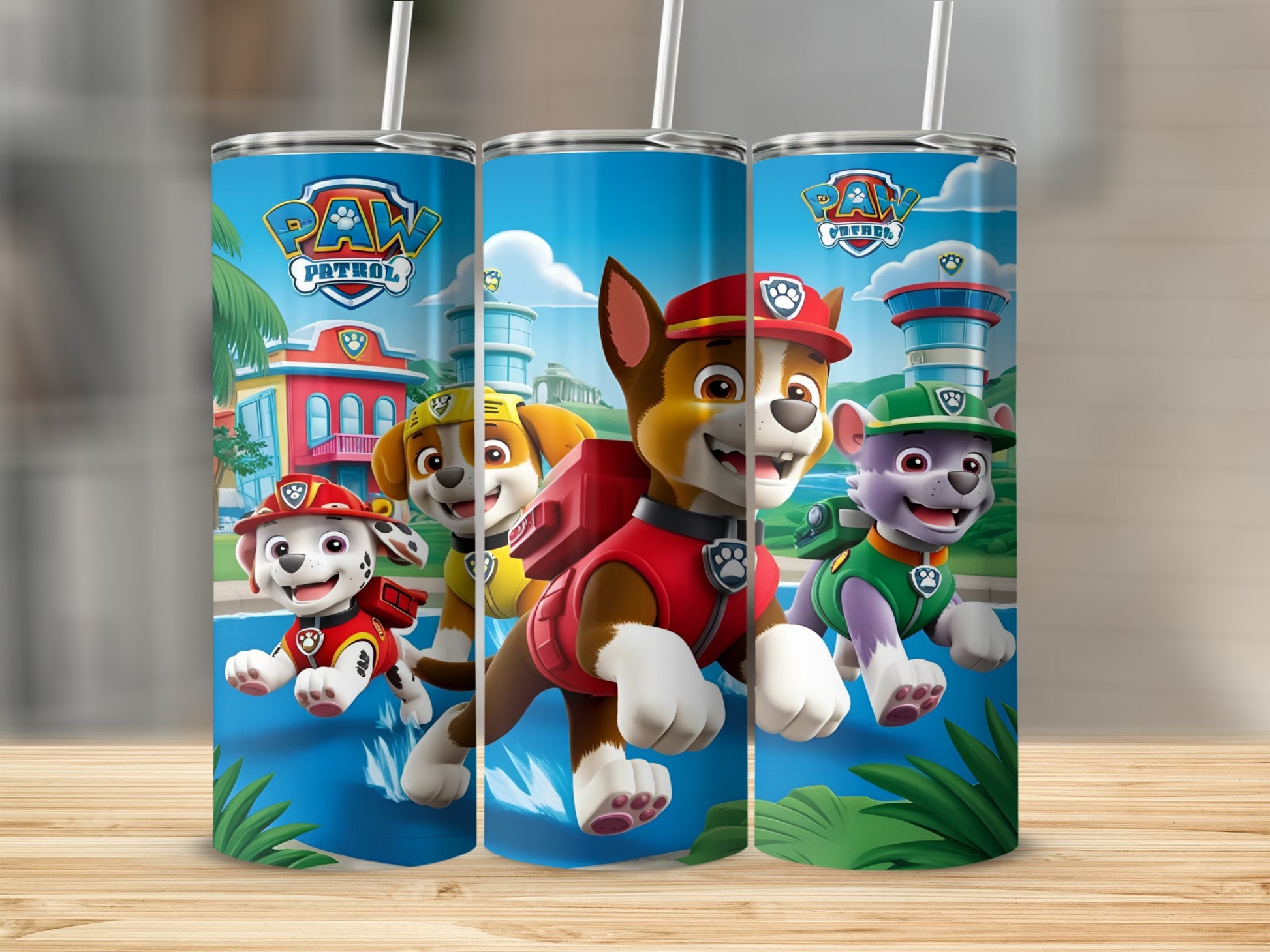 Paw Patrol pups Marshall, Chase, and Rubble running on a blue path.