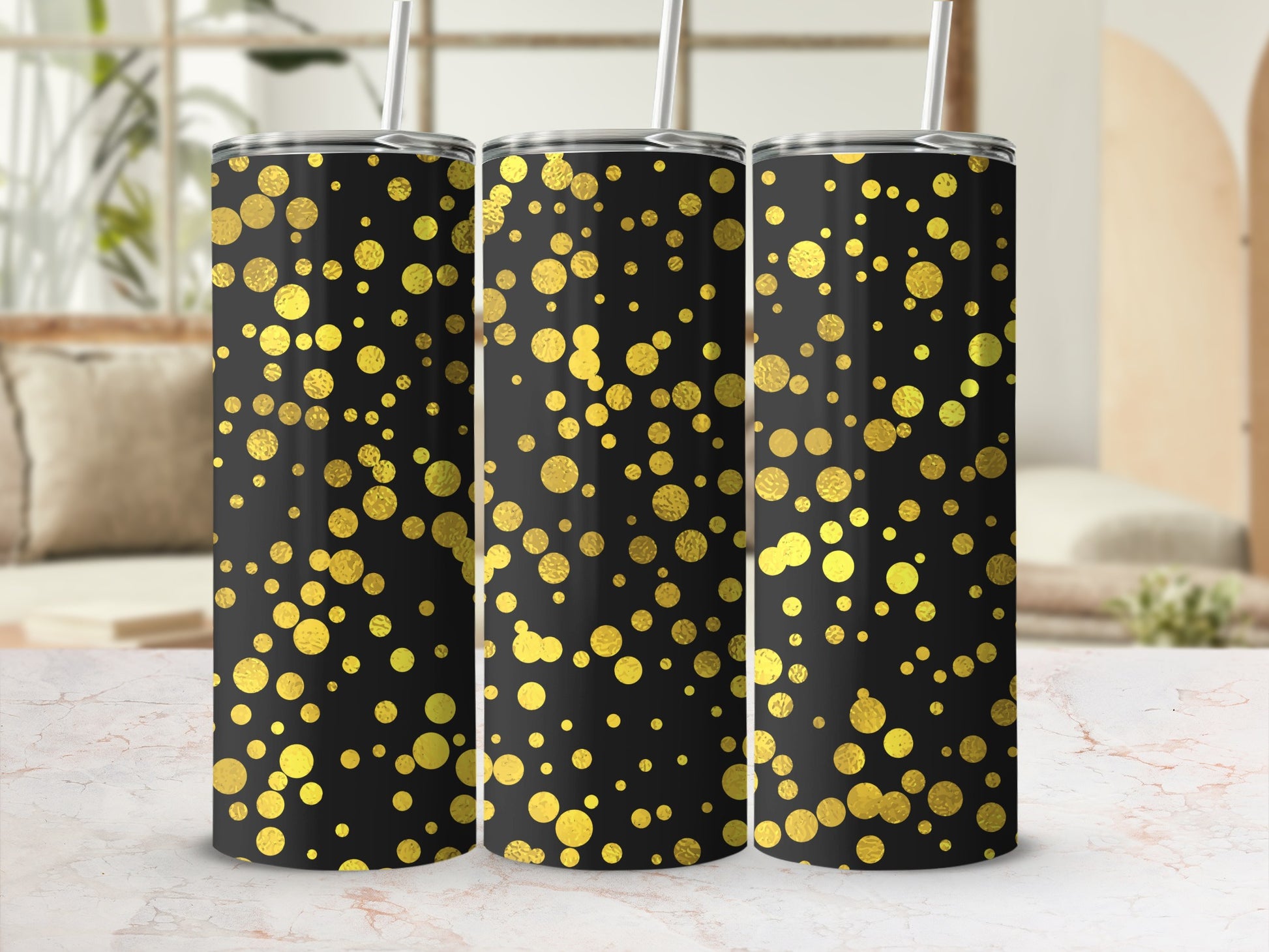 Three black tumblers with gold confetti pattern and white straws.