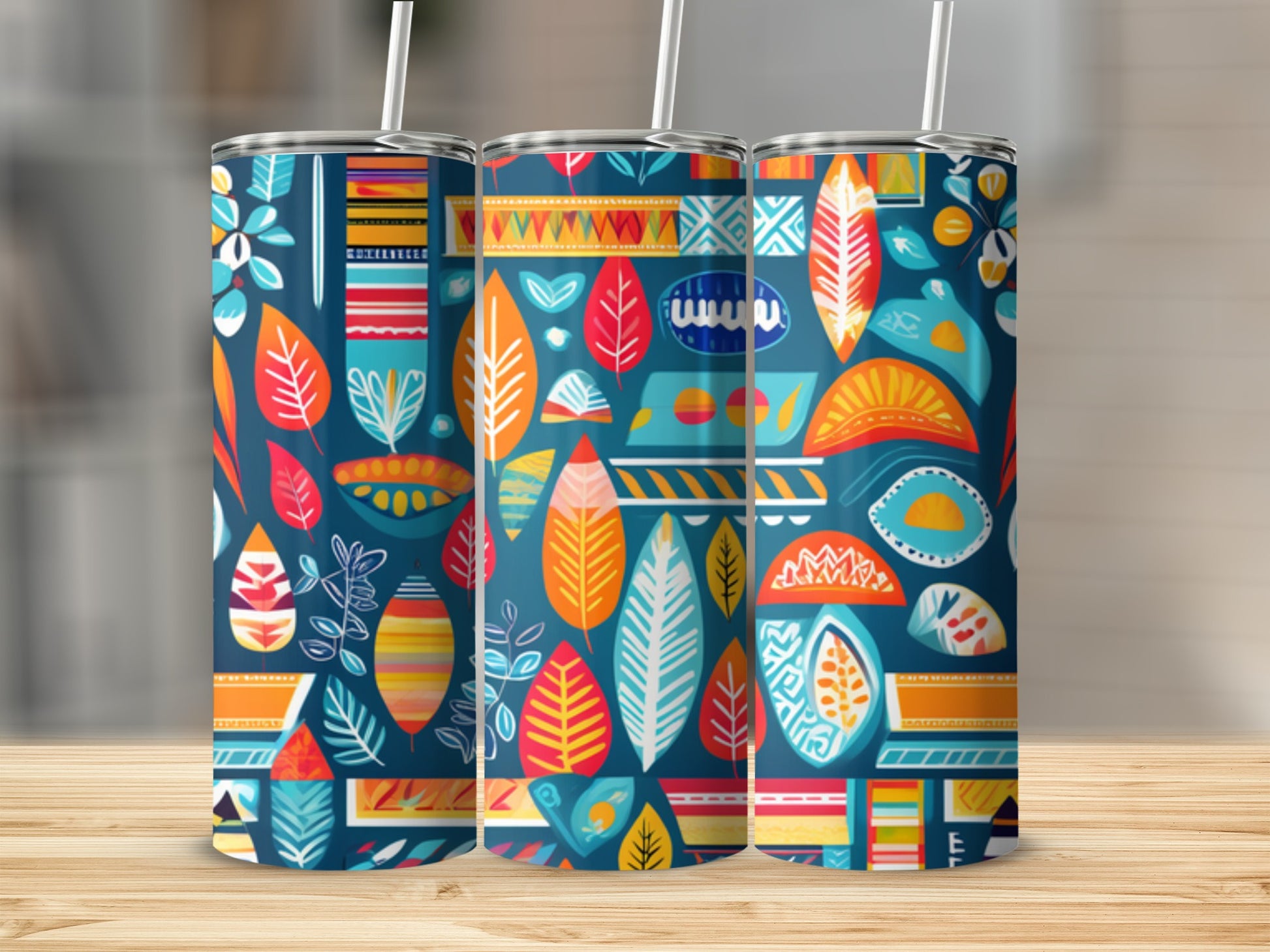 Three tumblers with a colorful abstract pattern of leaves and geometric shapes.