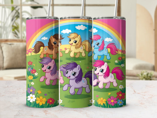 Three cartoon ponies running through a rainbow and flower field.